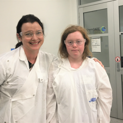 Two women in white lab coats